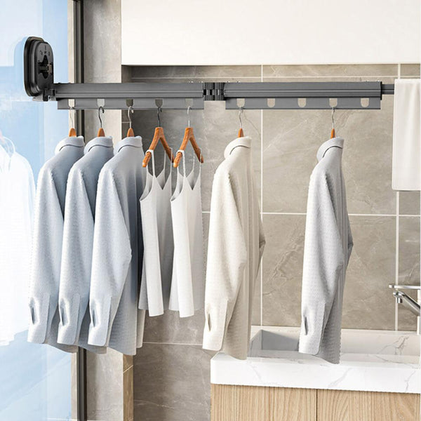 Wall-mounted retractable clothes hanger